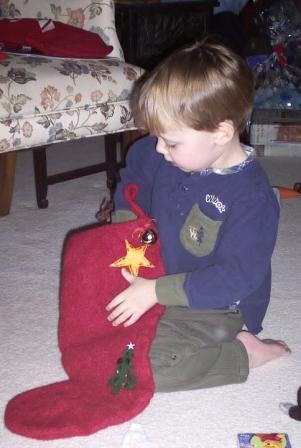 Evan opens his stocking Christmas morning at Grandma Shirleys house.