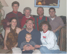 back row, left to right: Jennifer, Shirley, Chris, Mike; front row: Liz, Dave (holding Evan), Becky